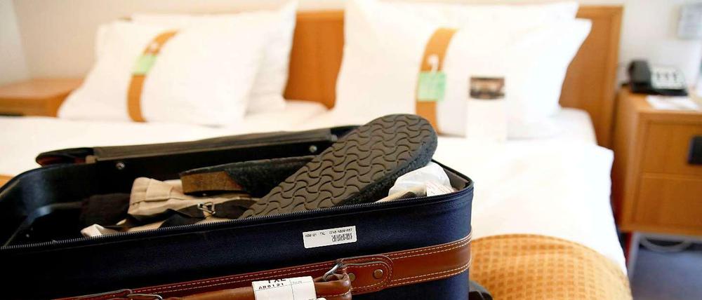 Geschäftsmann oder Urlauber? Seit dem Jahresbeginn müssen Hoteliers privaten Gästen eine Steuer in Höhe von fünf Prozent des Übernachtungspreises in Rechnung stellen.