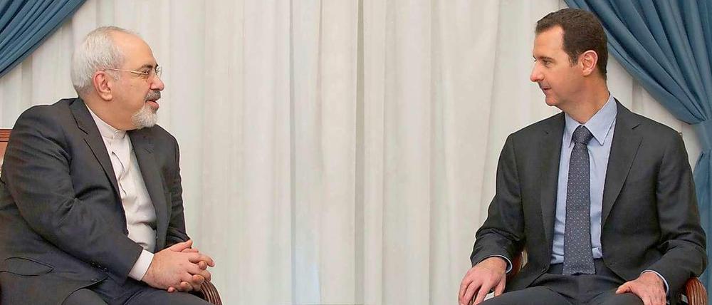 Verbündete: Irans Außenminister Sarif und Syriens Herrscher Assad.