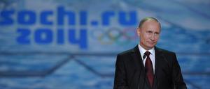 1996 klebte auf den Olympischen Spielen das Etikett von Coca-Cola - jetzt ist es das Gesicht von Wladimir Putin.