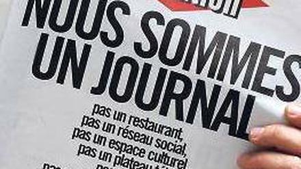 „Wir sind eine Zeitung“, mit dieser Schlagzeile protestiert die Redaktion der „Libération“ gegen die Umbaupläne. Foto: AFP