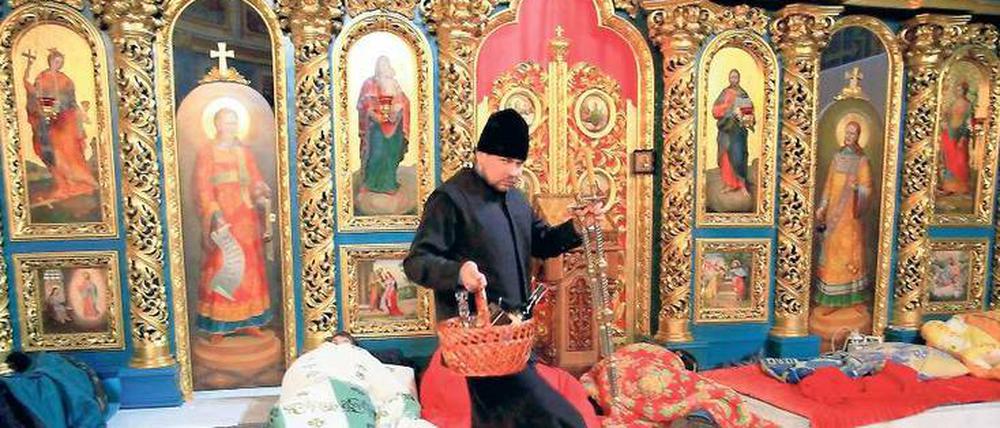 Kirche als Zuflucht. Oppositionelle übernachten in der Mikhailovsky Zlatoverkhy Kathedrale in Kiew.
