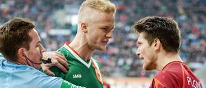 Keine bösen Wörter! Augsburgs Vogt und Hannovers Pocognoli im Disput.