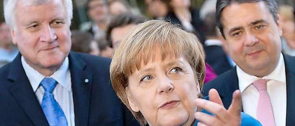 Die Parteichefs Angela Merkel (CDU), Horst Seehofer (CSU) und Sigmar Gabriel (SPD)