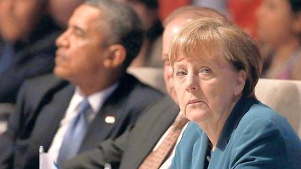Unterschiedliche Perspektiven nehmen Amerikaner und Europäer beim Thema Freihandel ein. Beide Seiten, hier Barack Obama und Angela Merkel in Brüssel, betonen die Chancen eines Abkommens – Verbraucherschützer und Gewerkschaften eher die Risiken. Foto: dpa