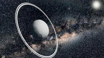 Überraschend. Den kleinen Asteroiden namens Chariklo umgibt ein Ringsystem aus Eis und Gestein (hier eine künstlerische Darstellung). Bisher wurden solche Ringe nur Planeten wie dem Saturn zugeschrieben.