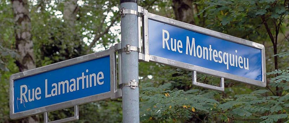 Sichtbare Wurzeln: Straßenecke in der Cité Foch in Berlin.
