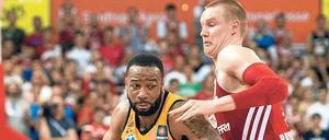 München Heat. Albas Reggie Redding (links) hatte mit der Hitze in der Halle zu tun.