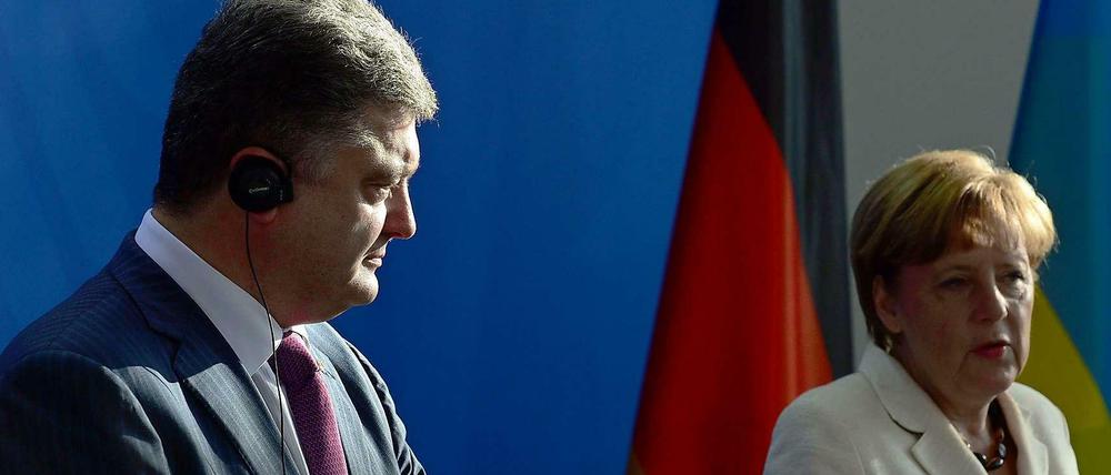 Gemeinsam für Besserung der Lage in der Ukraine? Petro Poroschenko (l.) und Angela Merkel.