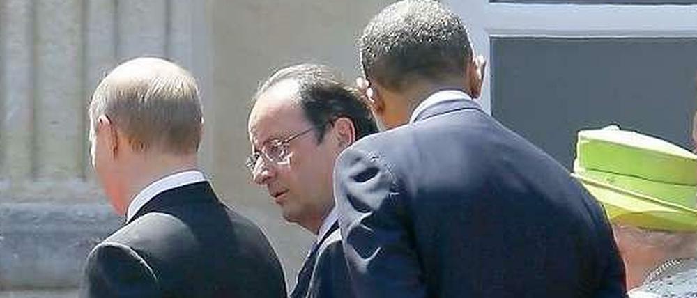 Dicht beisammen. Russlands Präsident Putin, Frankreichs Staatschef Hollande, US-Präsident Obama und die britische Königin Elizabeth II. (v.l.n.r.)