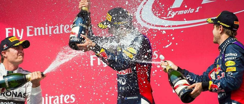 Daniel Ricciardo (Mitte), Nico Rosberg (l.) und Sebastian Vettel (r.) auf dem Siegerpodest in Kanada.