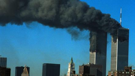 394261 07: Smoke pours from the World Trade Center after being hit by two planes September 11, 2001 in New York City. (Photo by Carolyn Schaefer/Getty Images)