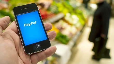 Paypal im stationären Einzelhandel. Der Bezahldienst kooperiert mit dem Berliner Start-up Payleven.