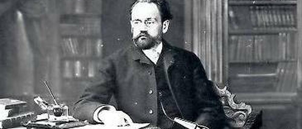 Émile Zola an seinem Schreibtisch.