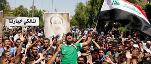 "Maliki, Du bist unsere Wahl", steht auf dem Schild. Anhänger von Premier Maliki demonstrieren in Bagdad.