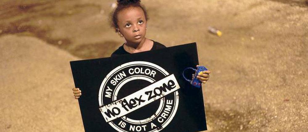 Die Lage verbessern. Auch dieses kleine Mädchen protestiert in Ferguson gegen die Erschießung von Michael Brown.