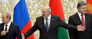 Putin, Lukaschenko und Poroschenko (von links) am Dienstag in Minsk