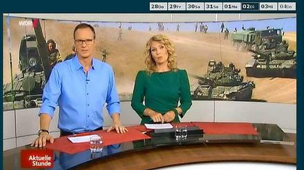 Die "Aktuelle Stunde" am Dienstag - mit einem sechs Jahre alten Foto aus dem Kaukasus-Krieg als Hintergrundbild im Studio