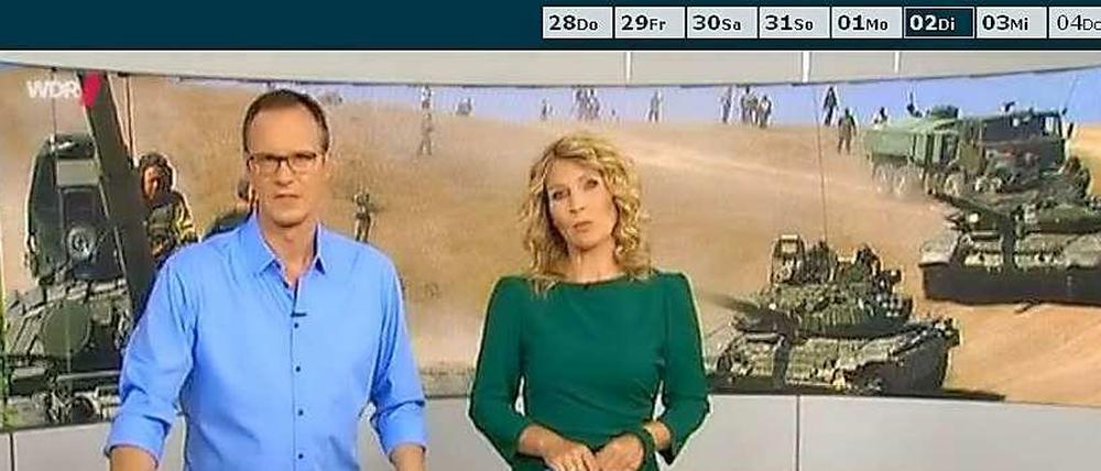 Die "Aktuelle Stunde" am Dienstag - mit einem sechs Jahre alten Foto aus dem Kaukasus-Krieg als Hintergrundbild im Studio