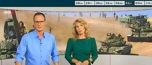 Die "Aktuelle Stunde" am Dienstag - mit einem sechs Jahre alten Foto aus dem Kaukasus-Krieg als Hintergrundbild im Studio