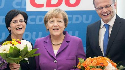 CDU-Chefin Angela Merkel eingerahmt von Christine Lieberknecht (Thüringen) und Michael Schierack (Brandenburg).