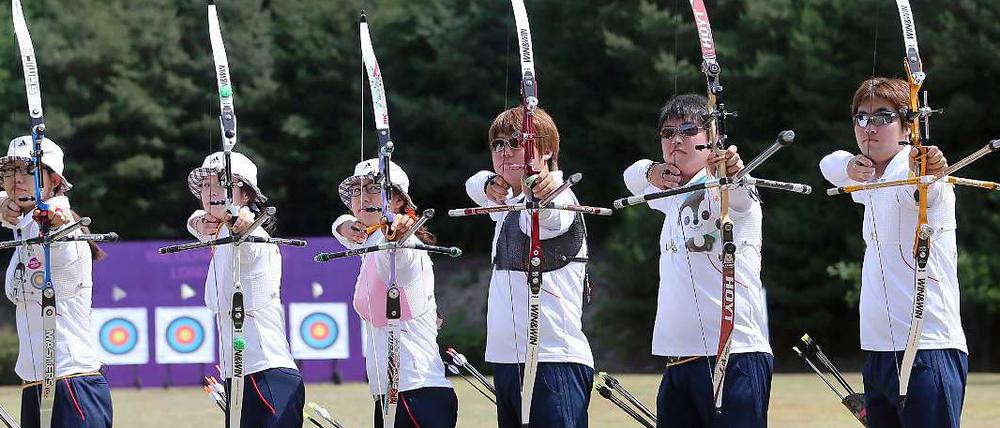 Nationalhelden mit Pfeil und Bogen. Das südkoreanerische Bogenschießen-Team bei den Olympischen Spielen in London.