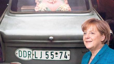 Eigene Fremdheitserfahrung. Es sei nicht schön gewesen, als „Zonenwachtel“ verunglimpft zu werden, erinnerte sich Angela Merkel – hier 2011 in einer Fotoausstellung – am Mittwoch in Berlin an die ersten Jahre nach der deutschen Einheit.