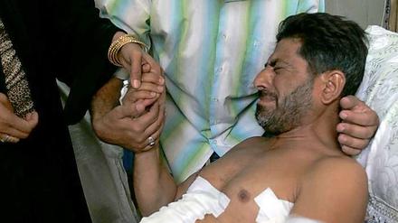 Ein durch Schüsse eines Blackwater-Söldners veletzter Iraker im September 2007 in einem Bagdader Krankenhaus.