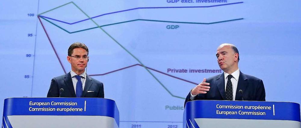 EU-Wachstumskommissar Jyrki Katainen (links) und Wirtschafts- und Finanzkommissar Pierre Moscovici haben bei ihrem ersten Auftritt in ihrem neuen Amt nicht sehr gute Nachrichten mitgebracht.
