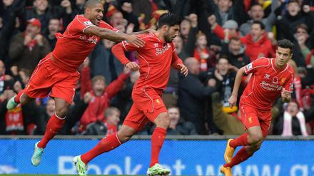 Glen Johnson (li.) und Philippe Coutinho feiern mit Emre Can den ersten Premier-League-Treffer des Ex-Leverkuseners.