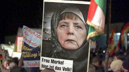 Ist die Verschleierung der Kanzlerin nun kritisch gemeint - oder als Lob für ihre Akzeptanz des Islam? 