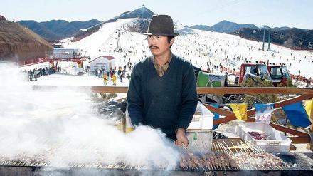 Heißes Eisen. Trotz großer ökologischer Bedenken gilt die Bewerbung Pekings als Favorit für die Spiele 2022. Die Skifahrer werden an den Strecken auf jeden Fall gut versorgt. Foto: AFP