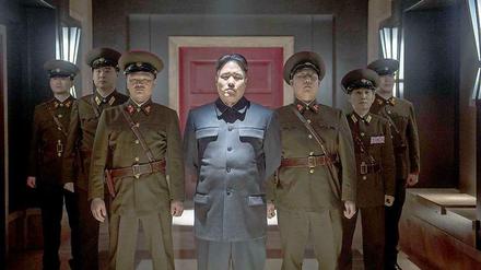 Eine Szene des Films "The Interview" zeigt den Nordkoreanischen Diktator Kim Jong-un mit seinen Ministern.