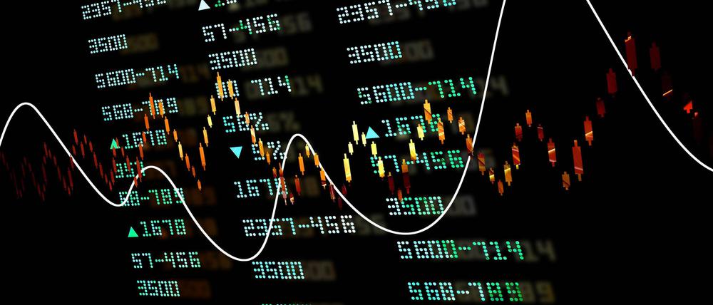 Gold coins with financial stock chart Copyright: xcuteimagex Panthermedia27631730