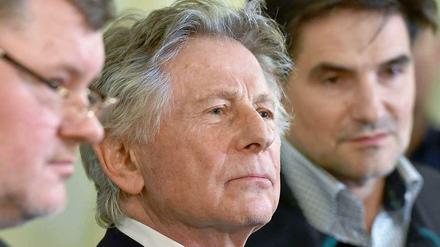 Roman Polanski mit seinen Anwälten am 25. Februar 2015 in Krakau.