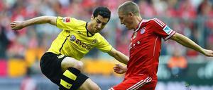 Immer gern gesehen. Bastian Schweinsteiger (r.) und Dortmunds Henrich Mchitarjan von Dortmund kämpfen um den Ball. 