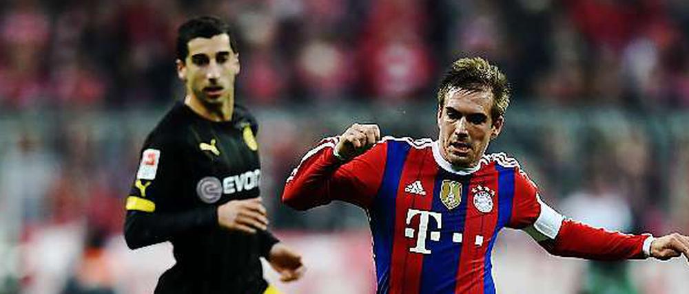 Enge Sache. Philipp Lahm (r.) und Dortmunds Henrich Mchitarjan.