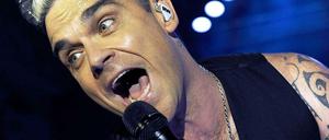Robbie Williams, mit neuer Frisur, spielt am Dienstagabend in Berlin. 