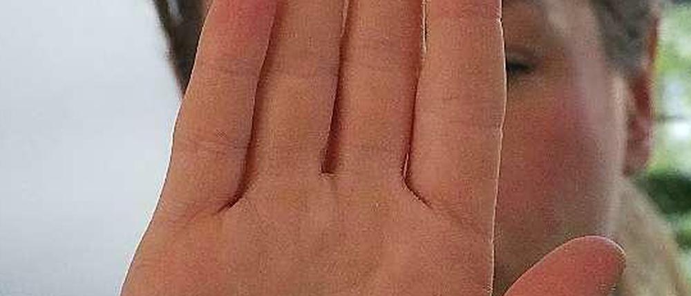 Welcher Kopf steckt hinter diesen Händen?