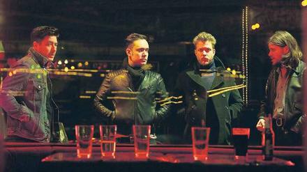 Söhne Mumfords. Die im Bandnamen angedeuteten Familienverhältnisse um Bandleader Marcus Mumford (links) sind eher symbolisch zu verstehen.