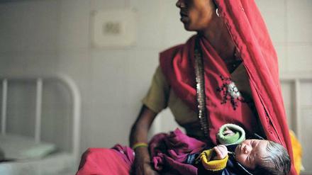 Indische Mutter mit Baby