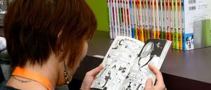 Ja, wie lesen sie denn? Eine Comic-Konsumentin bei der Manga-Lektüre.