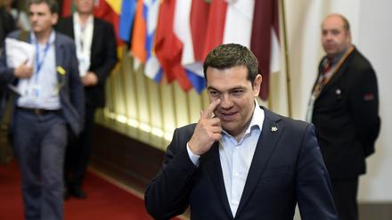 Griechenlands Ministerpräsident Alexis Tsipras nach dem Treffen mit Frankreichs Präsident Francois Hollande and Kanzlerin Angela Merkel