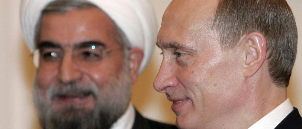 Wladimir Putin (r.) und Hassan Rohani
