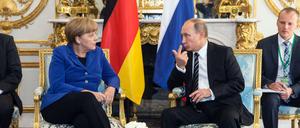 Angela Merkel und Wladimir Putin vor dem Gipfel in Paris.