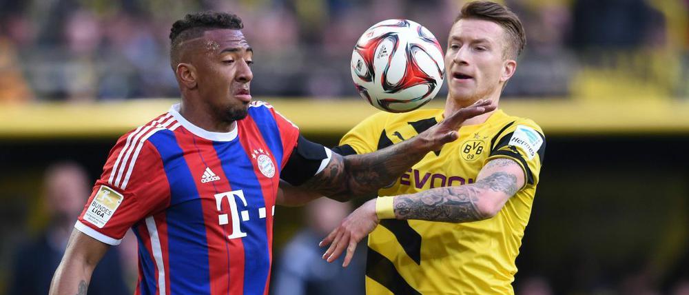 Topspiel: Marco Reus (r.) und Borussia Dortmund empfangen Jerome Boateng (li.) und den FC Bayern, hier beim letzten Liga-Aufeinandertreffen im April.