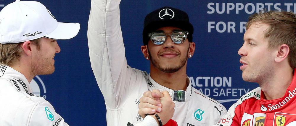 Weltmeister Lewis Hamilton (M.), Nico Rosberg (l.) und Sebastian Vettel (r.).