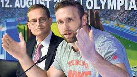 Ernster Blick. Robert Harting (r.) und Michael Müller sehen Probleme – aber auch Hoffnung. 