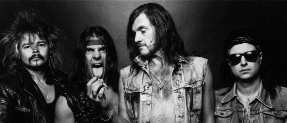 Phil Taylor (l.) mit den anderen Motörhead-Bandmitgliedern Michael Burston, Lemmy Kilminster und Phil Campbell auf einer Aufnahme von 1985.