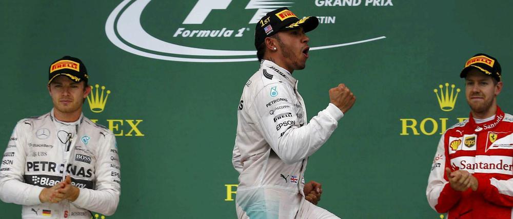Lewis Hamilton (M.), Nico Rosberg (l.) und Sebastian Vettel (r.).