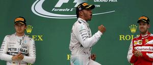 Lewis Hamilton (M.), Nico Rosberg (l.) und Sebastian Vettel (r.).